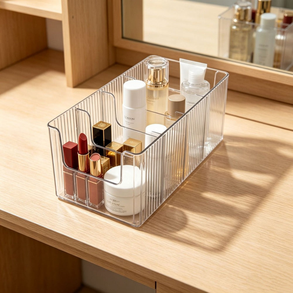 Clear divided bin with skincare on a vanity