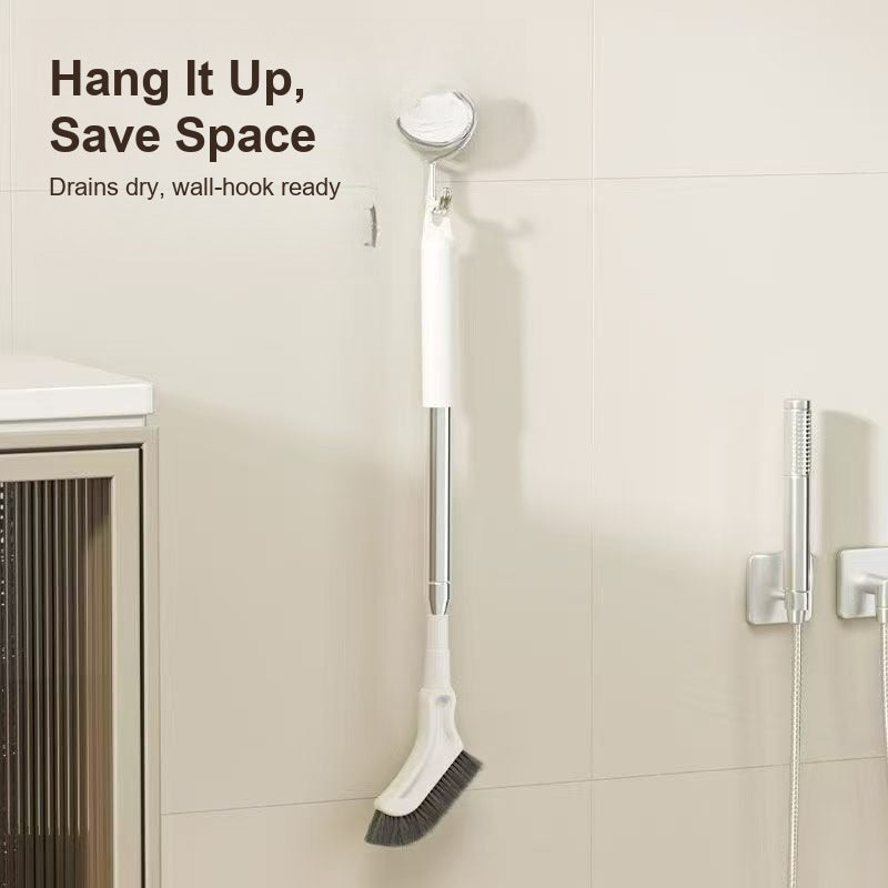 Crevice brush hanging on a bathroom wall