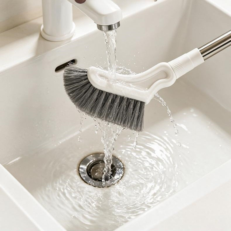 Rinsing the brush head under a tap