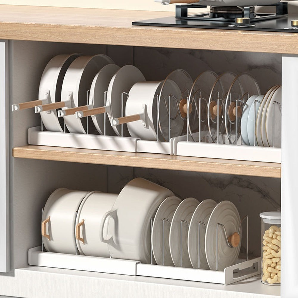 Pots and pans upright in a cabinet