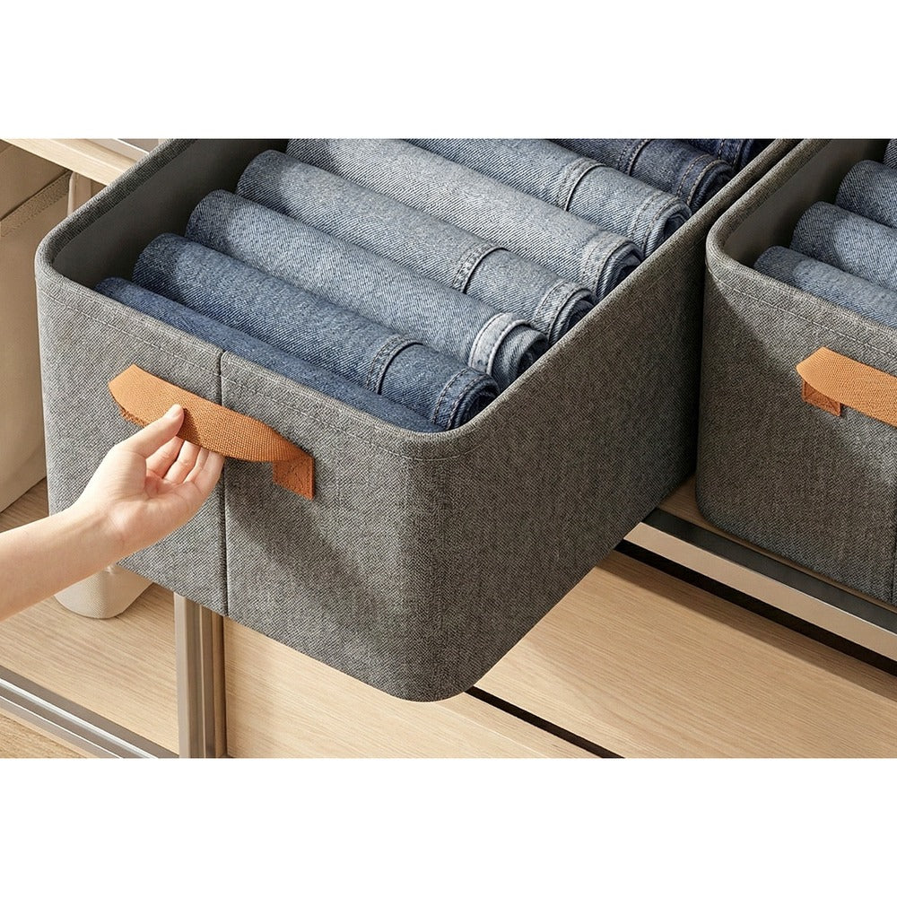 Pulling an 18L fabric storage bin out of a closet shelf