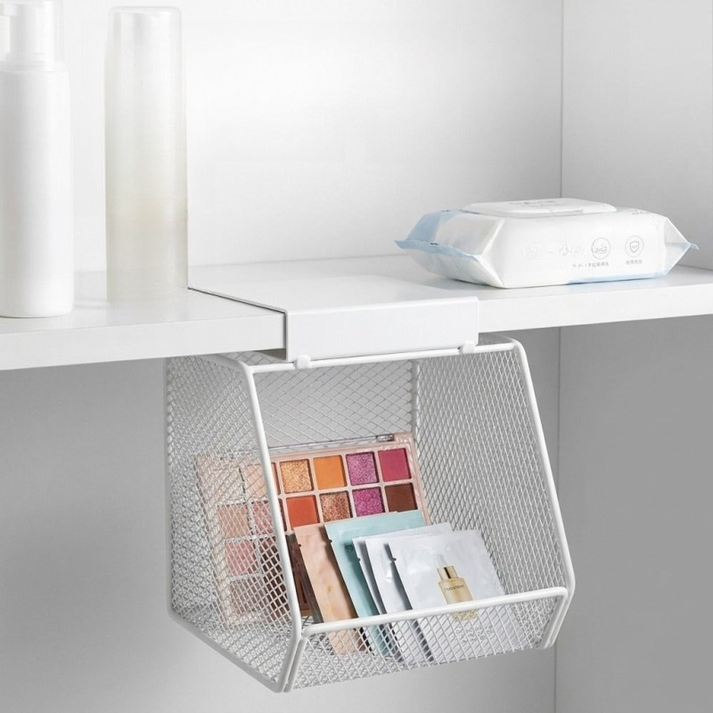 Eyeshadow palettes stored in a white mesh basket