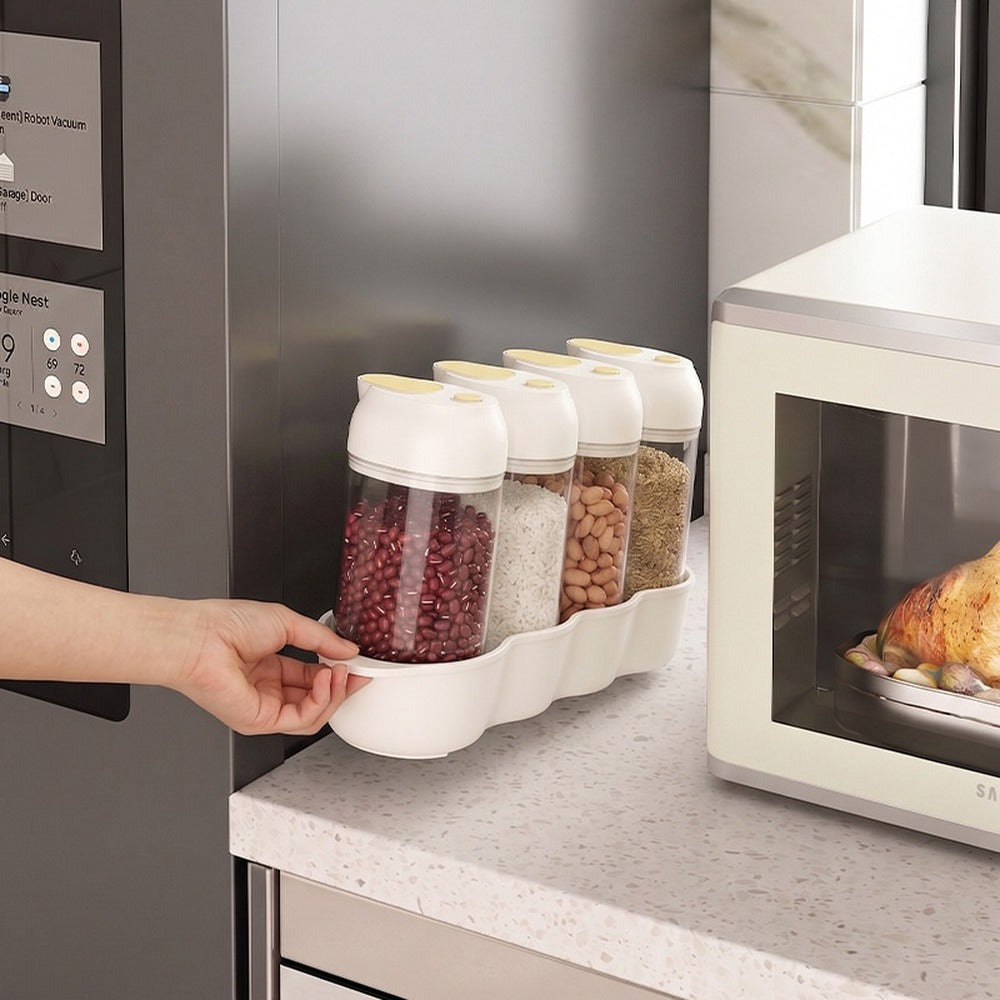 Slim grain dispenser jars beside the microwave