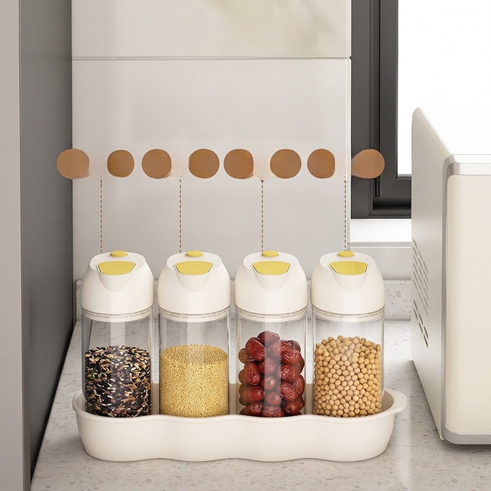 Four jars filled with beans, rice and grains