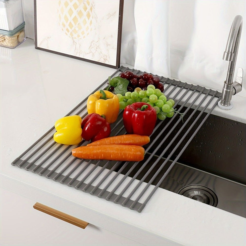 Roll-up dish rack over the sink with vegetables