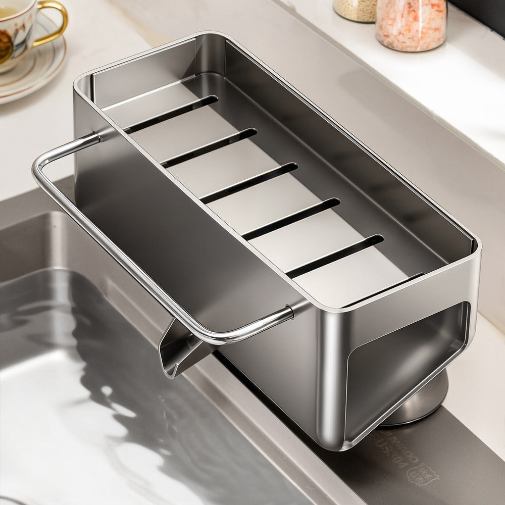 Gunmetal gray suction sink caddy on kitchen sink ledge