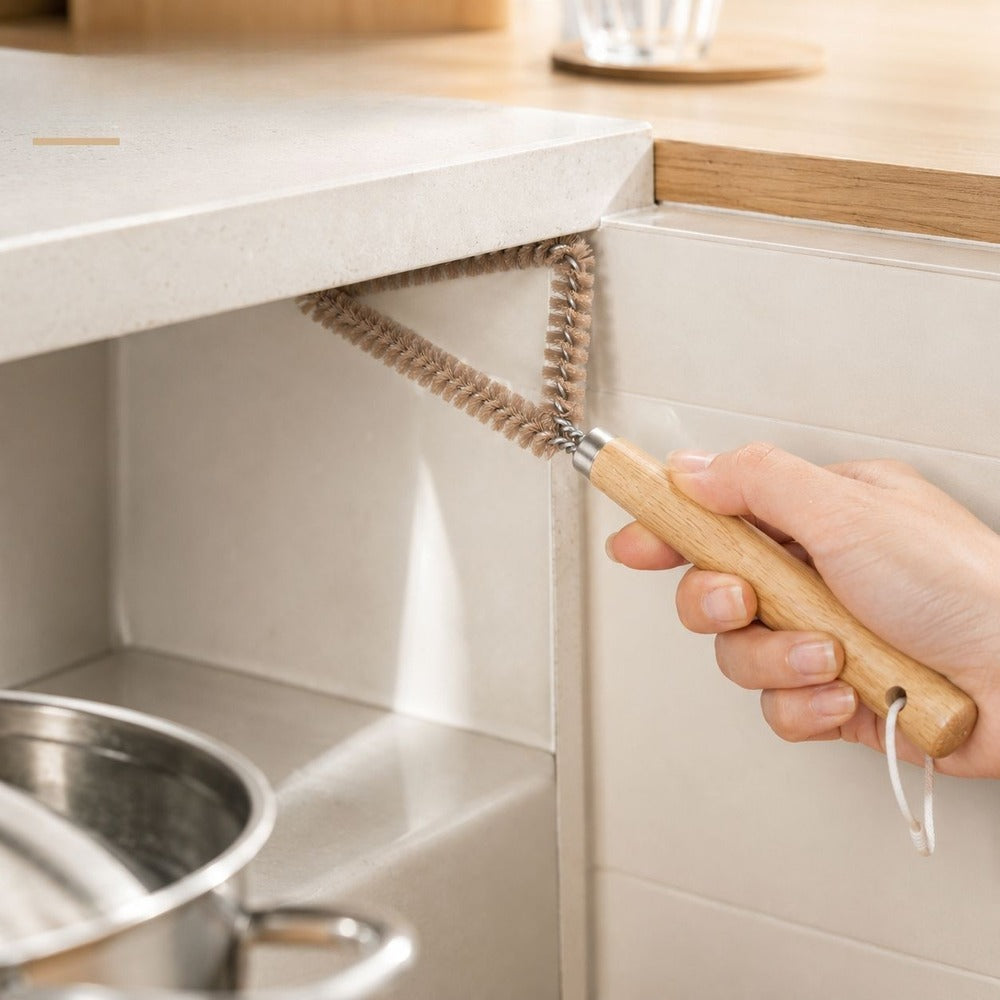 Cleaning under the cabinet edge