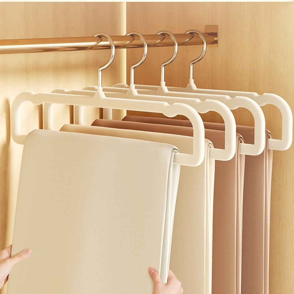 Trousers hanging straight on velvet hangers