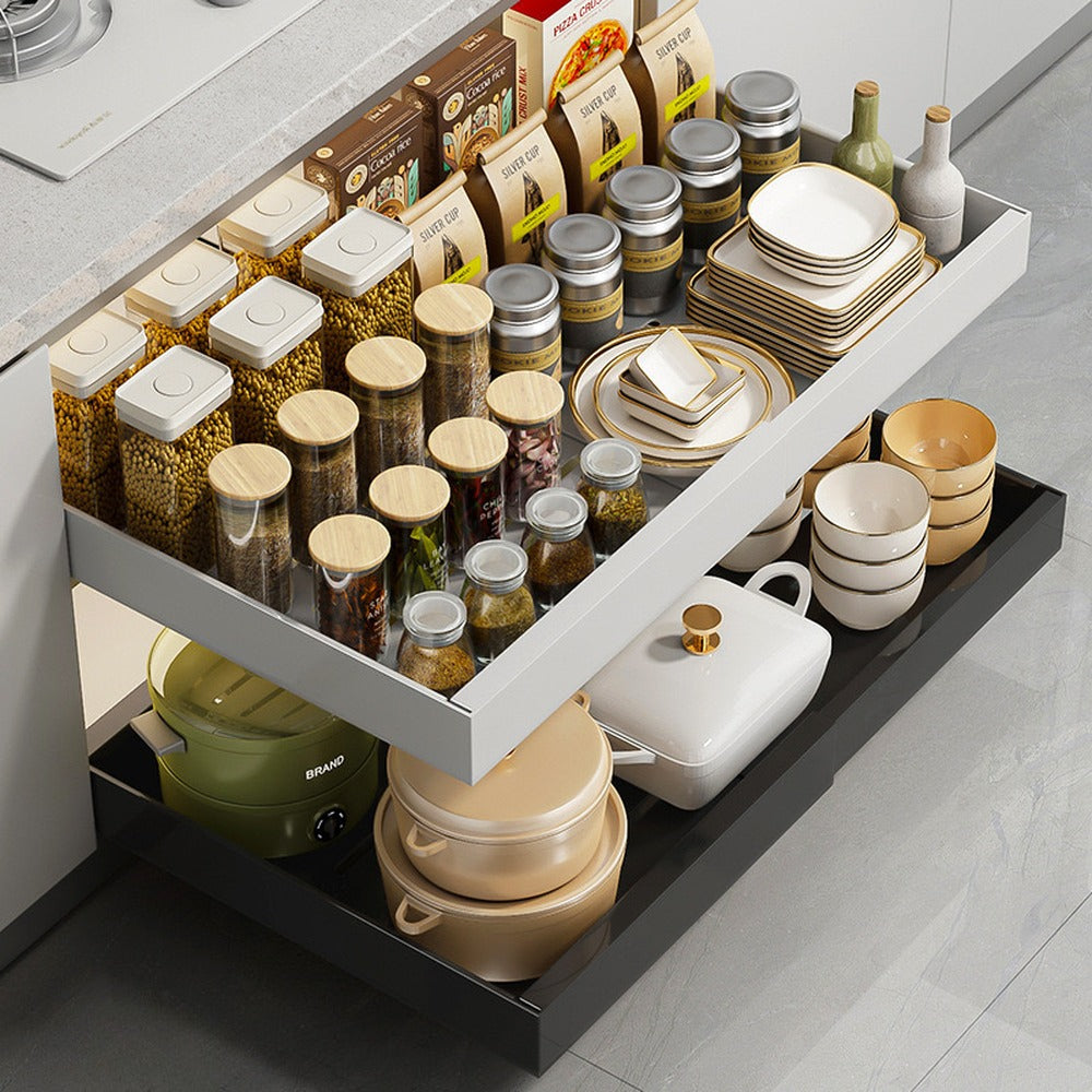 Two sliding cabinet drawers holding spices and cookware
