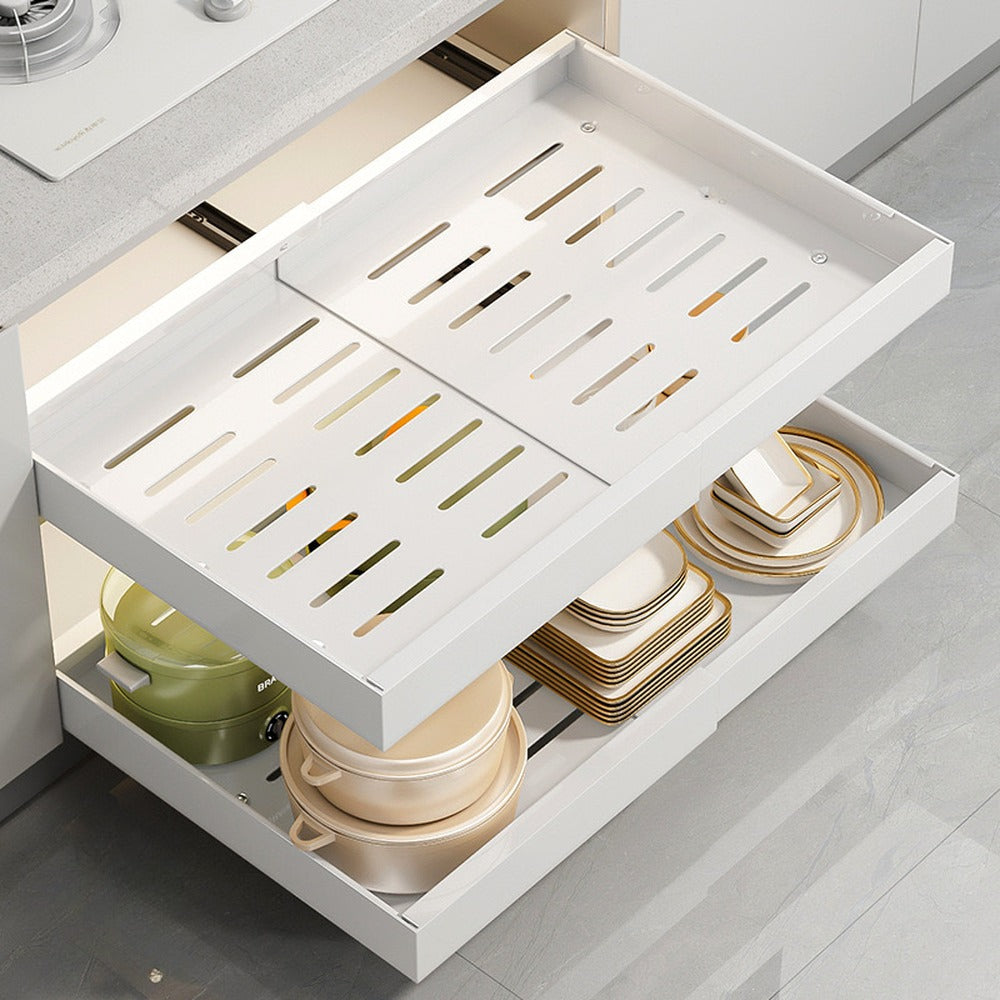 Vented white pull-out tray slid out of a base cabinet